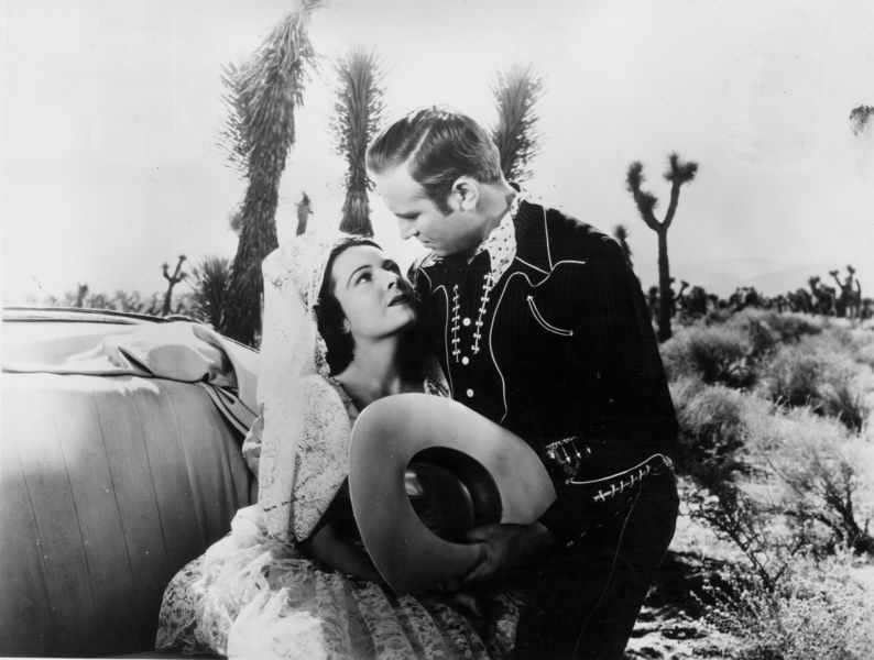 A sultry Lupita Tovar with co-star Gene Autry—one of the many stars Kohner and Tovar feted at their B