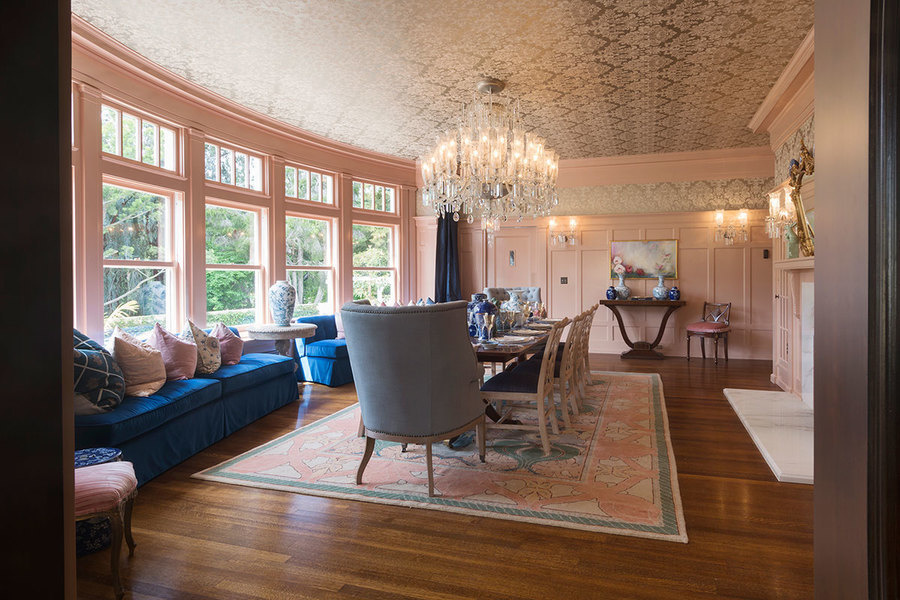 A statement chandelier takes center stage in this formal dining room.