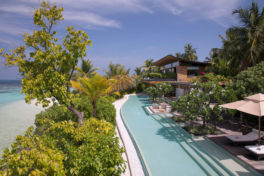 A villa and the main swimming pool of Coco Privé