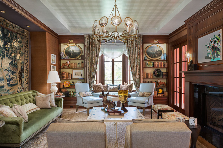 Artwork and upholstery lend refined elegance in a room for gentlemen designed by Josh Hildreth, princ